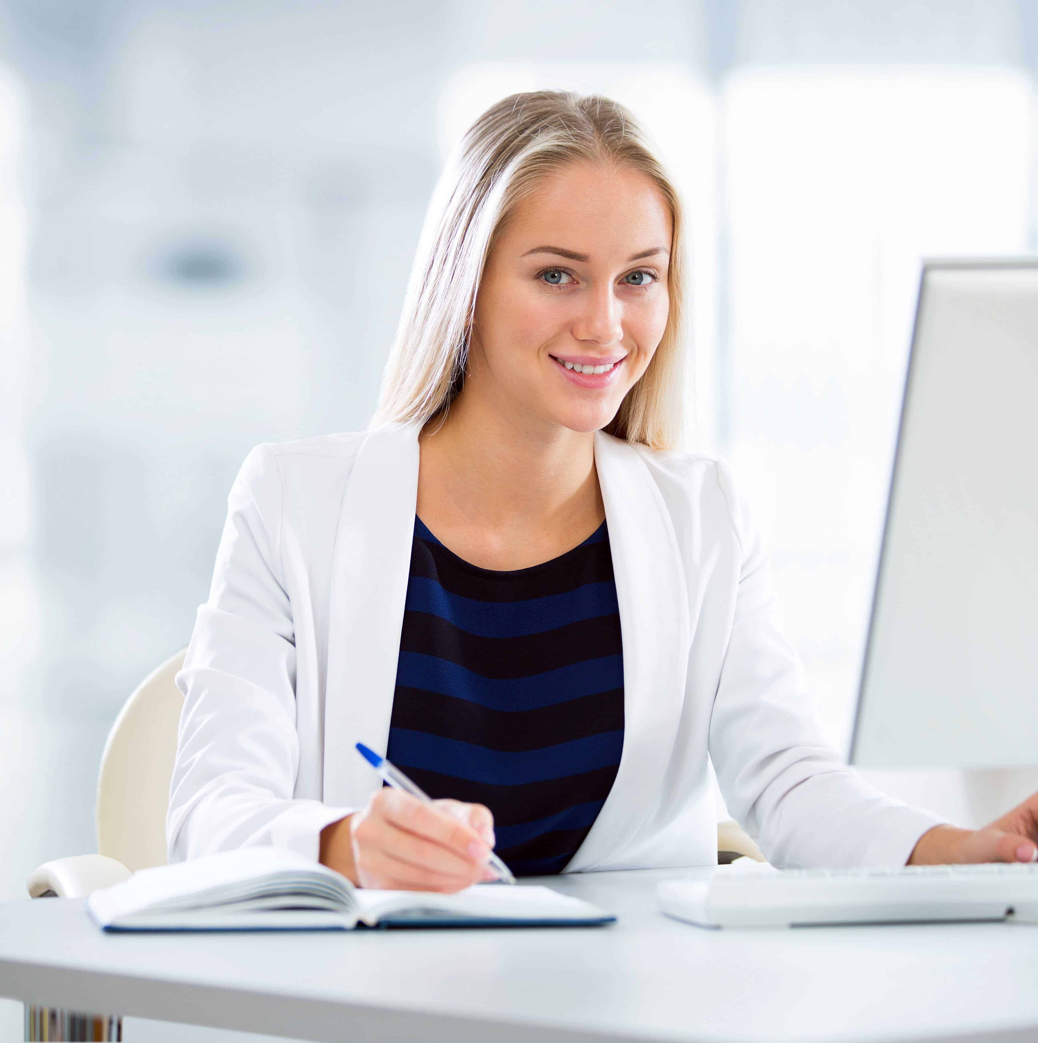 Young business woman using computer at office