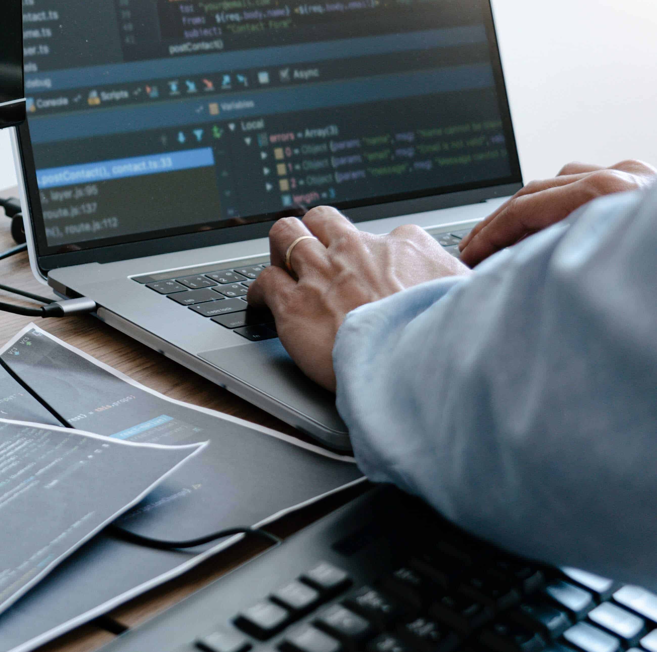 Programmer working On Computer In IT Office Typing Data Coding i